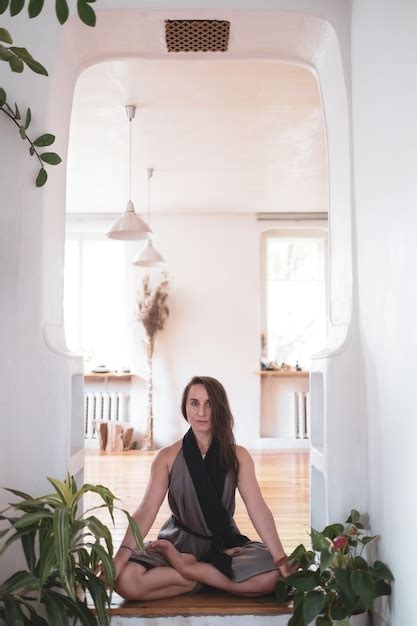 Premium Photo | Woman practicing yoga lesson breathing meditating doing ...