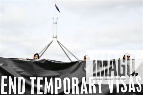 Canberra Refugees Rally Attendants Hold A Banner During A Rally For