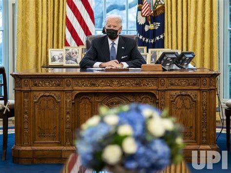 Photo President Biden Signs An Executive Order Overturning Trumps