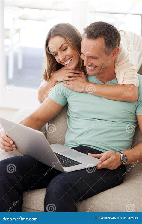 Computer Hug And Happy Couple On Sofa For Internet Online Reading And