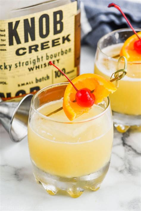 The Best Whiskey Sour Recipe Garnished With An Orange And Cherry