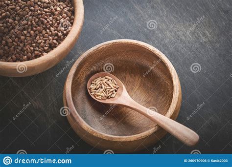 World Food Crisis Concept Empty And Full Old Plate With Buckwheat On A