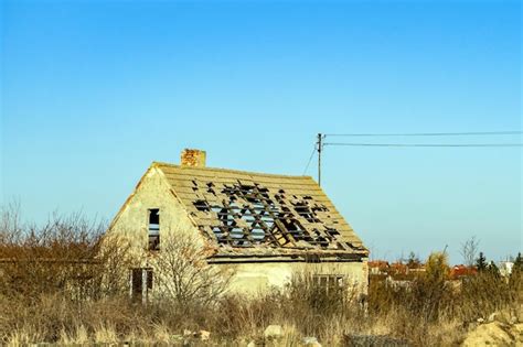 Premium Photo An Old Dilapidated Abandoned House On Vacant Lot