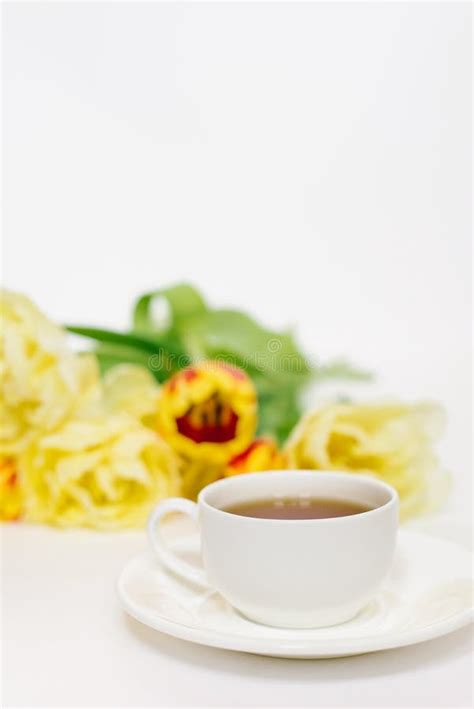 White Porcelain Tea Cup and Bright Spring Flowers Tulips Stock Photo ...