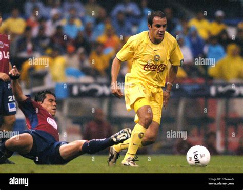 America's soccer player Cuauhtemoc Blanco, right, controls the ball away from the tackle of ...