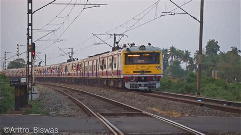 Speedy Curvy EMU Local Train Crossing A Rail Gate Near Khamargachhi