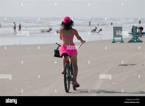 Lady In Pink Bikini Riding Bicycle On Beach Stock Photo Alamy