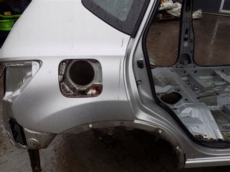 NISSAN QASHQAI J10 KY0 Blotnik Prawy Tyl Cwiartka 11837562928