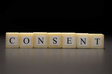 The Word Consent Written On Wooden Cubes Isolated On A Black Background