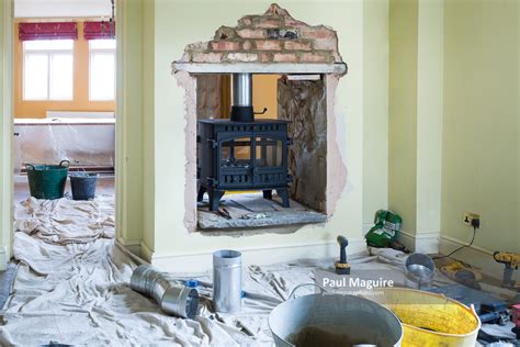 Photo for sale - Installing wood burning stove, UK home improvement ...