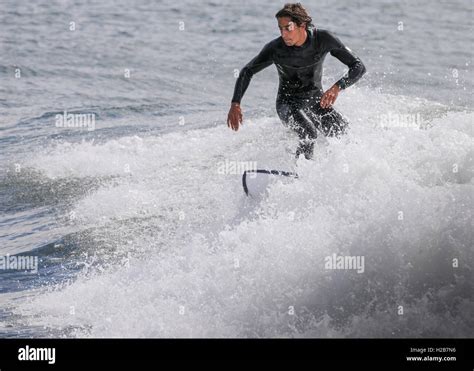 Surfer surfing in Estoril Cascais Portugal Stock Photo - Alamy