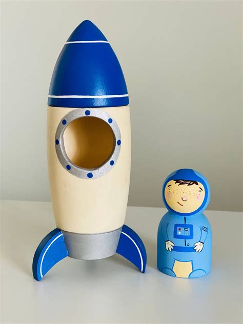 Dark Blue Rocket Ship with Astronaut from PoppyBaby Co – Blossom