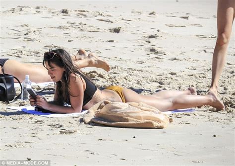 Olympia Valance flaunts her pert derrière in bikini in Byron Bay