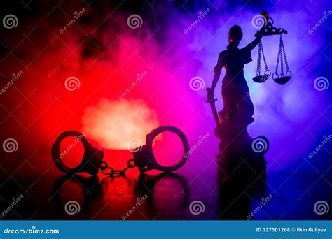 Legal Law Concept Silhouette Of Handcuffs With The Statue Of Justice