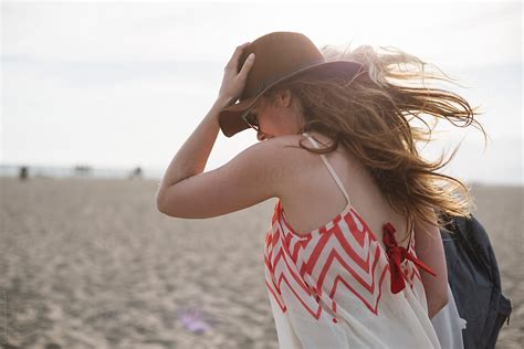 «young Woman Walking On The Beach Del Colaborador De Stocksy «simone