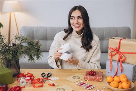 Premium Photo Woman Wrapping Christmas Presents Gifts