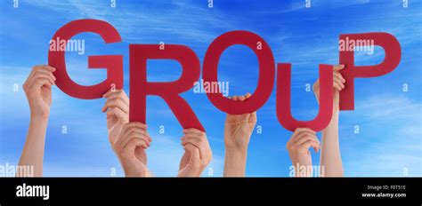 Many People Hands Holding Red Word Group Blue Sky Stock Photo Alamy