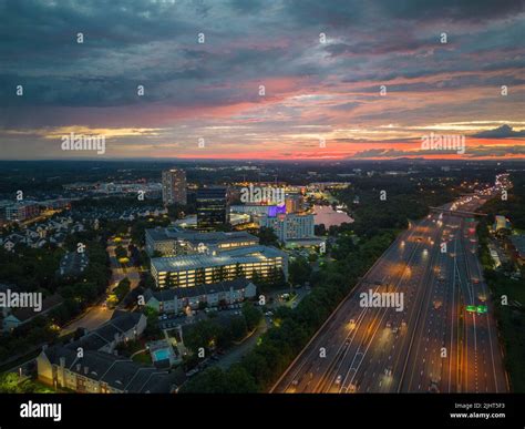 An aerial view of illuminated Gaithersburg cityscape with busy highway ...