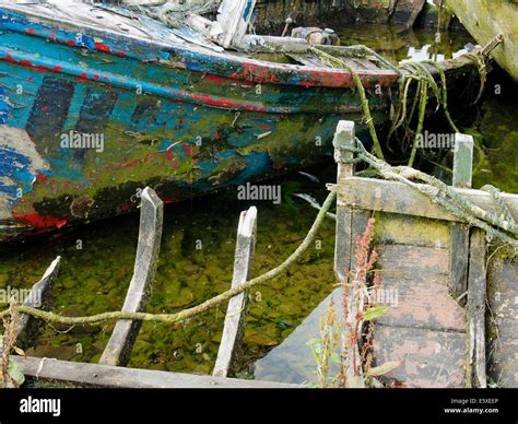 Abandoned Fishing Boats Rotting In A Quiet Corner Of The Claddagh Basin