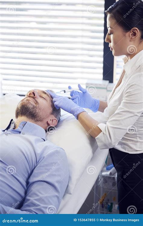 Female Beautician Doctor With Patient In Wellness Center Professional