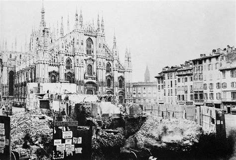 An Old Black And White Photo Of A Cathedral In The Middle Of Town With