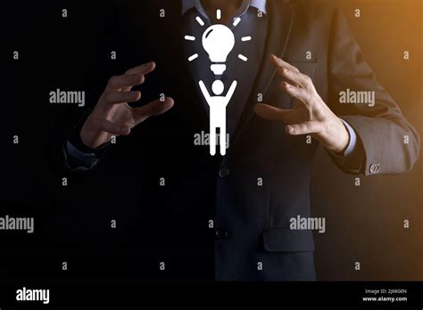 Businessman Hold Man Icon With Light Bulbs Ideas Of New Ideas With