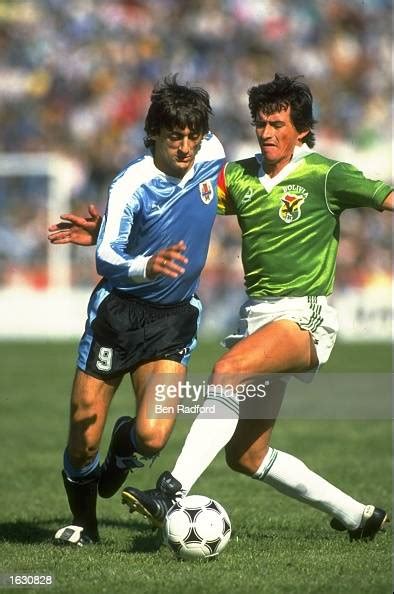 Enzo Francescoli of Uruguay is tackled during the World Cup... News ...