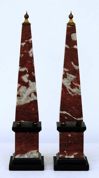 A Pair Of Marble Obelisks In Rosso Venato And Marmo Nero With A Metal