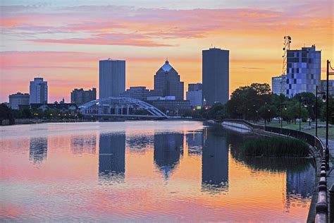 The Rochester Skyline at Sunrise Reflecting on the Genessee River ...