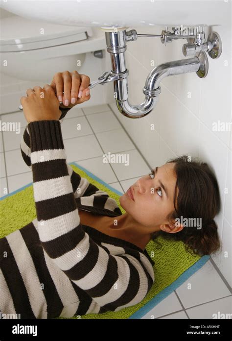 Female Plumber Under Sink Hi Res Stock Photography And Images Alamy