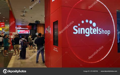 Customers visit Singtel retail shop in Singapore – Stock Editorial Photo © tang90246 #251458706