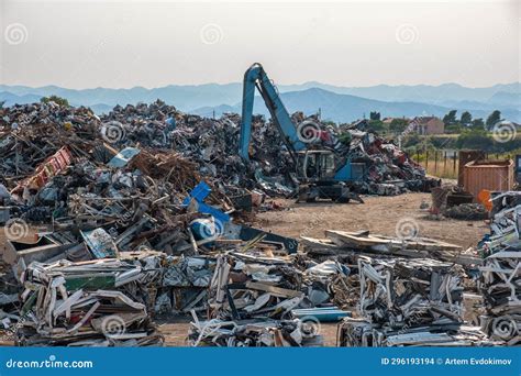 Clow Crane Picking Up Scrap Metal At Recycling Center For Metal