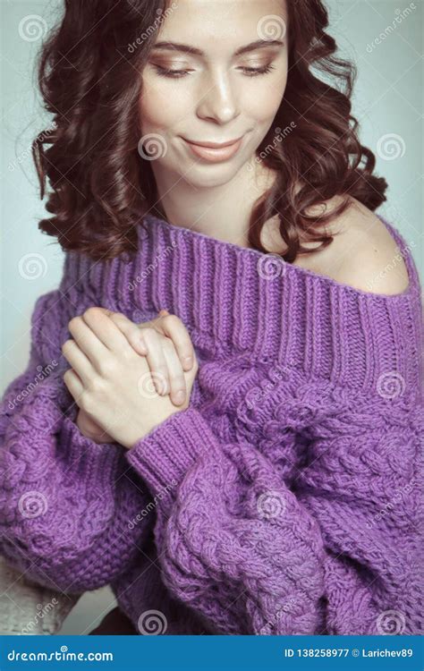 Portrait Of Beautiful Woman With Makeup In Knitted Purple Oversize