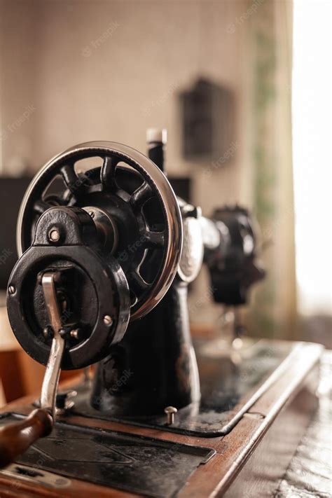 Premium Photo An Old Sewing Machine Stands On The Table At Home Ready