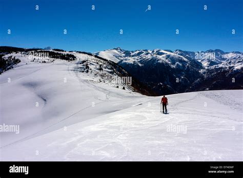 Female Figure In Red Snowshoeing Plateau De Beille Ariege French