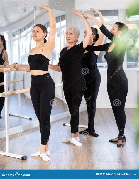 Adult Woman Teacher Correcting Female Dancers Stock Image - Image of
