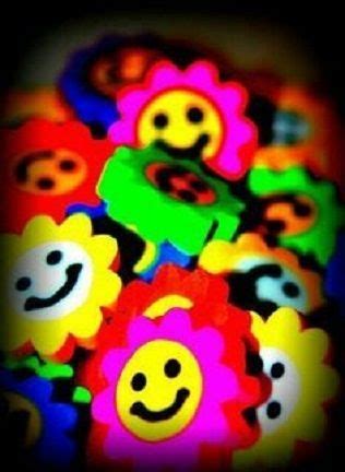 Many Different Colored Smiley Faces On A Black Background