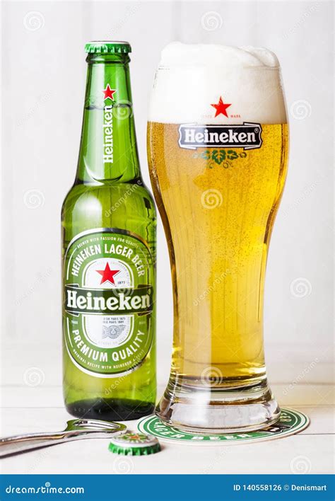 LONDON, UK - APRIL 27, 2018: Bottle of Heineken Lager Beer on Wooden Background with Original ...