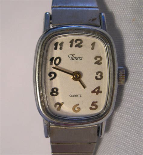 L56 Timex Ladies Silver Tone Watch On Flex Band Square Face Wristwatches