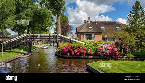 Panoramiv View Of The Water Canal And Traditional Dutch Brick Houses In