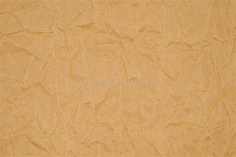 Brown Crumpled Wrapping Paper Background Texture Of Yellow Wrinkled Of