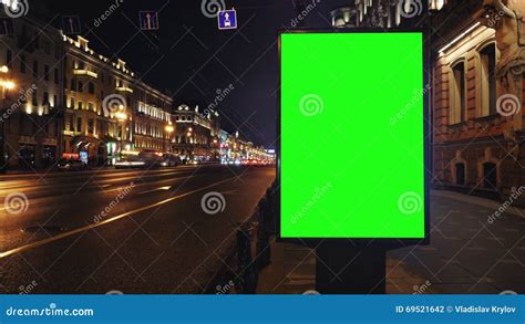 A Billboard With A Green Screen On A Busy Night Street Stock Footage