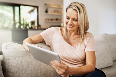 Im Social Even When Im Home Alone Shot Of A Mature Woman Using Her