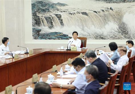 Li Zhanshu Presides Over Meeting Of Council Of Chairpersons Of Npc