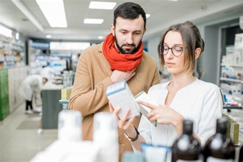 Pharmacist With Client In The Pharmacy Store Stock Photo Image Of