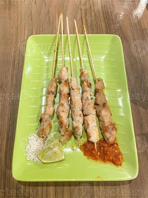 sate taichan chiken satay grilled  served  peanut seasoning