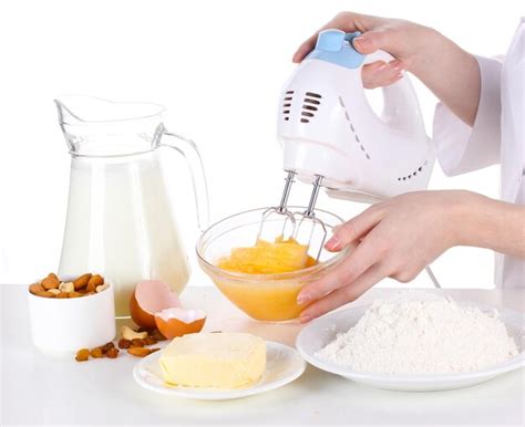 Premium Photo Female Hands Mixing Eggs In Bowl Isolated On White