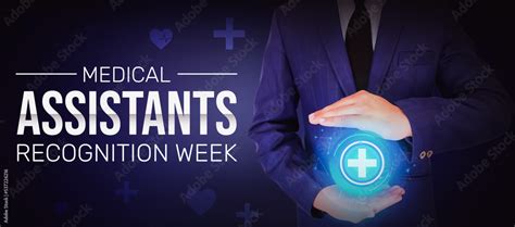 Medical Assistants Recognition Week Wallpaper With Glowing Health Sign In Between Hands