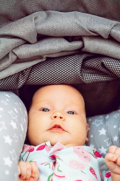 Premium Photo Cute Newborn Toddler Resting In A Baby Stroller Closeup