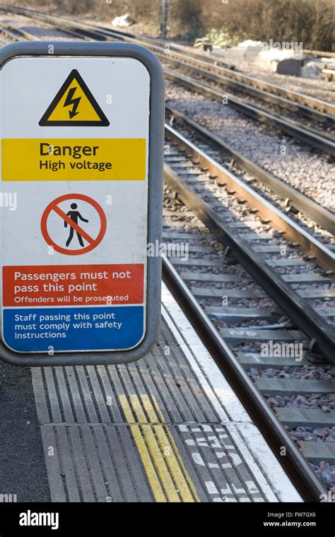 Danger High Voltage Warning Sign Next To Railway Tracks Stock Photo Alamy